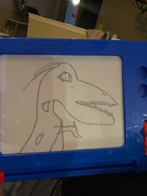 My almost  year old brother drew a velociraptor from memory and I transferred the image on a shirt for his  year olds birthday gift