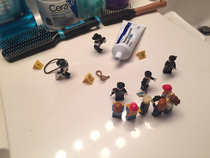 My brother cleaned and organized our bathroom while I was away last week Last night I accidentally left some things out so he set this little scene up with his Legos