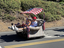 My buddy shared this with me He took the photo from a th of July parade I blurred the faces out of respect This is such an awesome golf cart
