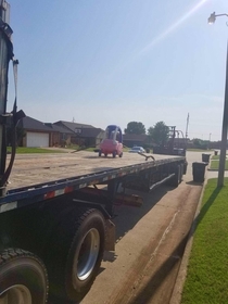 My dad a truck driver sent me this photo saying he found a toy car somebody was throwing away that hes gonna bring back for my son