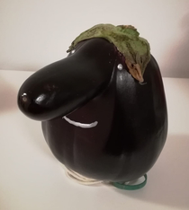 My dad bought a deformed eggplant and drew a face on it now I know who I got it from