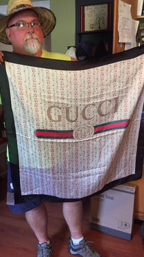 My dad ordered a pair of hiking boots and got this  USD Gucci silk scarf instead Hes thrilled