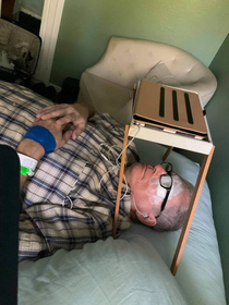 My dads homemade iPad holder for after his eye surgery