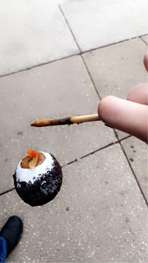 My daughter and I got treats from a candy shop today As she was snapping a friend her candy apple fell and was captured mid decent