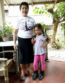 My grandma with Jesus Tshirt and lil cousin with the middle finger going to church