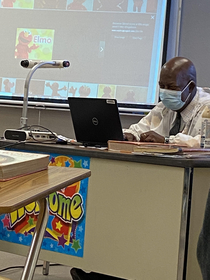my history teacher who is Jamaican searching up photos of elmo