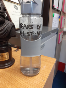 My history teachers water bottle reads Tears Of My Students