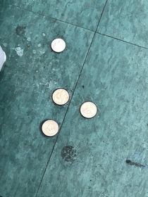 My local grocery store glued quarters to the floor