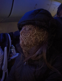 My mom fell asleep in the airplane And yesshe put her mask COMPLETELY over her face