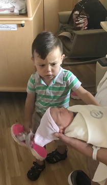 My  month old nephew meeting his new sister for the first time