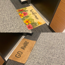 My neighbors and their conflicting door mats Right across from each other