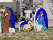 My neighbors put up their Christmas display incorrectly and it looks like Joseph and Mary are ashamed of Jesus