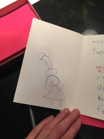 My niece drew her teacher wearing a Santa hat
