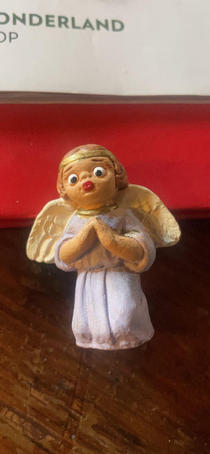 My parents have a very concerned very surprised angel ornament