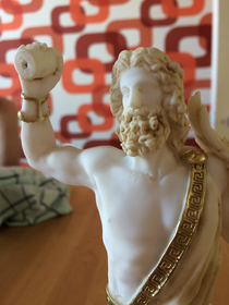 My statue of zeus broke and now it looks like zeus is throwing a roll of toilet paper at someone
