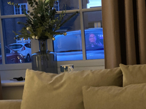 My wife looked out of our living room window and saw this TV screen reflection lined up perfectly with her car 