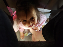 My wife sent me this photo after something tickled her foot under the table My daughter is the true ninja I think