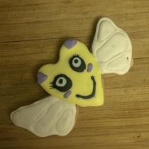 My wife tried cookie decorating this cookie looks like it hasnt slept in days