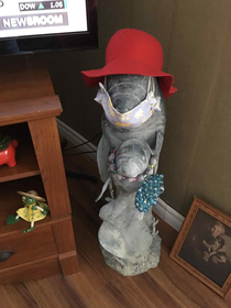 My  year old Grandma put a hat and mask on her manatee sculpture