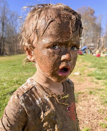 My year old nephew and fell into some mud while petting the pigs i dont think he was happy