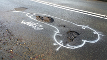 Mystery Artist Wanksy Paints Penises Around Potholes To Get Them Fixed