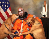 NASA Astronaut gets his official picture taken with his dogs
