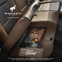 New Ford Bronco ad displays under seat storage for your gloves and knife available in white