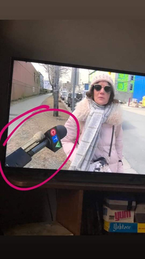 News outlet in Canada is taping their microphones to hockey sticks to maintain social distance