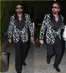 Nic Cage out here looking like he just got off a speedboat in Miami with  kilos of blow
