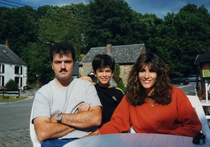 Nice family pic and somebody is refusing to smile This was at an outdoor cafe in Belgium and the drinks and food were taking too damn longHangry dad 