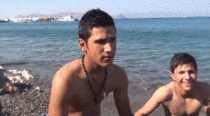 One of my favorite GIFs kid in background of news report gets stuck in his lifejacket