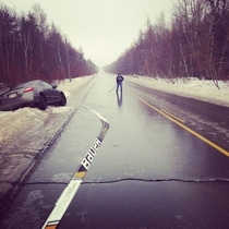 Only in Canada  The roads are so icy they did this while waiting for the tow truck to come