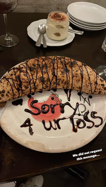 Ordered desert in a restaurant and it came with this un-requested message in chocolate