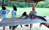 Our Cub Scouts met a man with an emotional support alligator named Wally