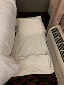 Our hotel was short a bed so I made one out of towels Housekeeping made it up along with the other beds when we were out