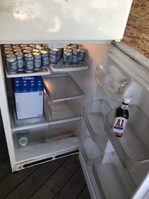 Our refrigerator out at the lake Filled with water and A sauce Everything we need
