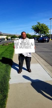 panhandler I met with an interesting sign