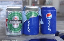Pic #1 - CAN-ouflage Smuggler caught trying to sneak  cans of beer into Saudi Arabia by disguising them as PEPSI