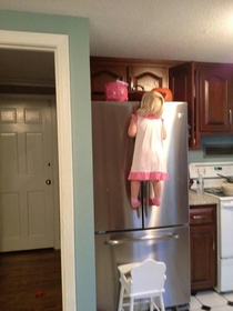 Pic #1 - Daredevil Halloween Candy Heist caught red handedwhile also removing the chair from beneath the fridge