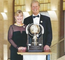 Pic #2 - All of these dumb-asses have each given Scientology  million so they could pose for these stupid pictures next to those stupid trophies