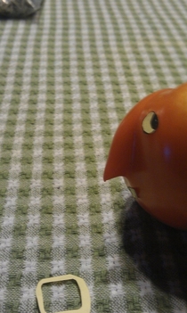 Pic #2 - We had a tomato with a strange growth My mom used a sticky note to make it into a nose