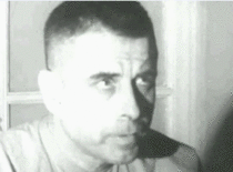 POW blinking in morse code to spell T-O-R-T-U-R-E during a forced interview