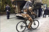 Predator riding a bicycle