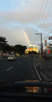 Rainbow touching a rainbow building