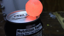 Red hot nickel ball on a can of soda