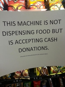 Replacing out of order sign at the work vending machine