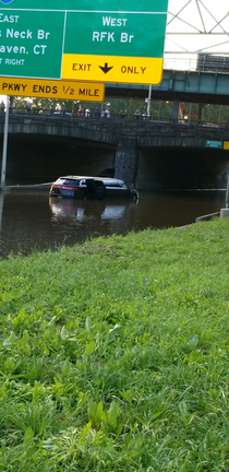 Riding high into the flooded road