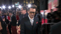 Robert Downey Junior taking off his sunglasses