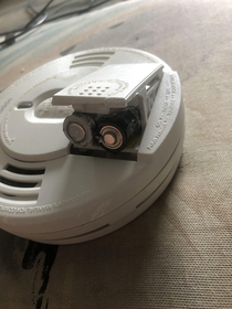 Roommate jammed AA batteries in the smoke detector it takes a single volt