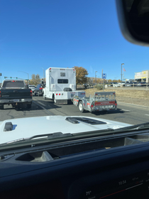 Saw a semi truck towing a tiny u-haul thought it was funny